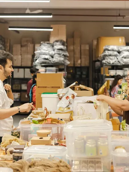 A candid shot of our team working together at the packing table. The energy and collaboration in our workshop are what make the magic happen.