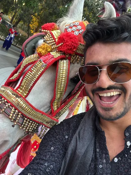 It's not every day you get a selfie with a ghodi! A fun, behind-the-scenes moment from a baraat, showing my playful side.