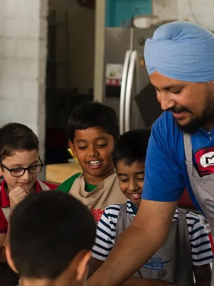 Our chef sharing his passion for cooking with the next generation. These moments of connection and learning are what we cherish most.