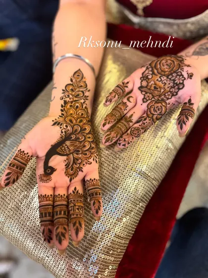 A chic and artistic choice for a modern bride. This design features a simple lotus mandala on the back of the hand and a graceful peacock on the palm, leaving plenty of open space.