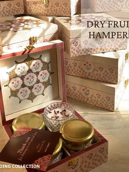 I also create dry fruit hampers as wedding favors. These are presented in beautifully painted wooden boxes that guests can reuse long after the celebration.