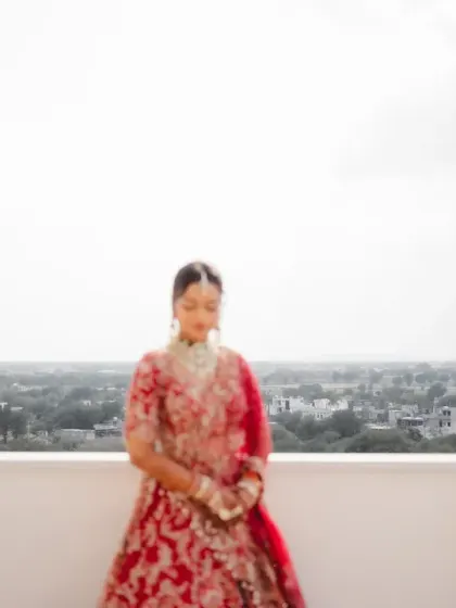 A motion-blur portrait of the bride on the balcony, conveying the whirlwind of emotions on her wedding day. This artistic shot adds a dreamy quality to her bridal story.