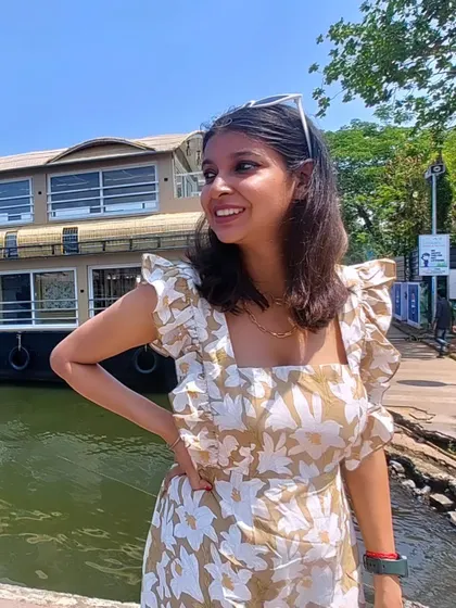 Posing by a houseboat in Alleppey. This dress was my go-to for exploring the beautiful scenery of Kerala.
