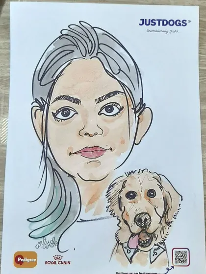 A live caricature of a woman and her golden retriever.