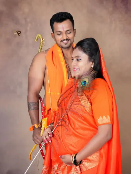 Another look from our Seetha-Ram inspired theme. This pose, with the peacock feather, adds a touch of divine symbolism and grace to the maternity portrait.