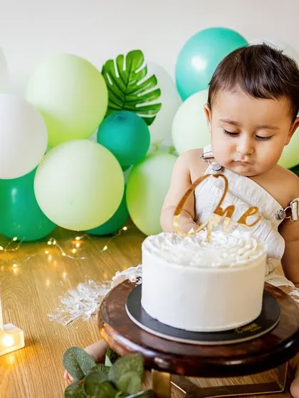 That moment of hesitation right before the fun begins. This little one is carefully inspecting his cake before making his first move.