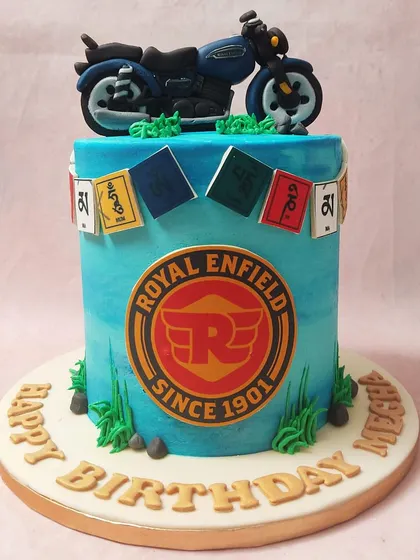 The intricate details, from the bike to the prayer flags, make this a truly special and personalized cake.