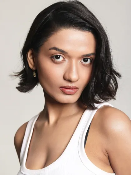 A close up on clean, natural makeup. The skin is fresh, the brows are defined, and the lips have a soft tint, creating a look that is effortlessly chic.