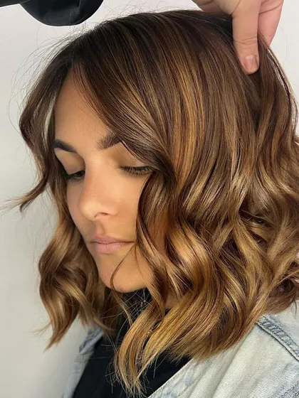 A stunning Caramel Balayage on a shorter, bob-length haircut. This shows how the technique can be adapted to create a customized look for any client.
