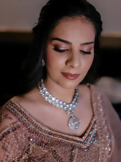 A close-up of this stunning reception makeup. The soft, shimmery eyeshadow and perfectly blended base create a look of pure elegance.