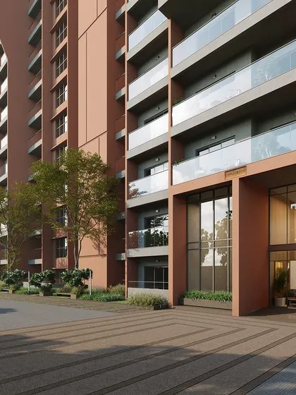 The entrance detail of a high-rise apartment building, where we used a combination of glass, textured concrete, and integrated planters to create a welcoming and modern arrival experience.