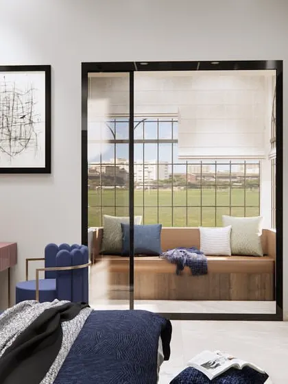 A full view of the bedroom, showing the balance of colors and textures. The deep blue bedding contrasts beautifully with the warm wood tones and clean white walls, creating a stylish and inviting space.