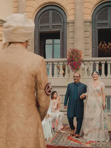 The bride's walk down the aisle with her father, a classic and emotional moment from the Vogue Weddings feature in Tuscany.