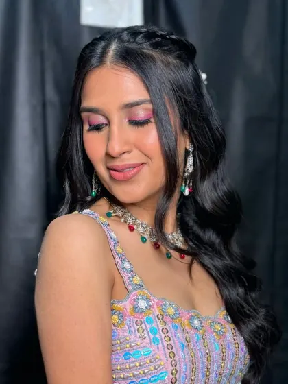 A close-up of the colorful eye makeup. A little bit of color can be a fun way to express your personality for pre-wedding events.
