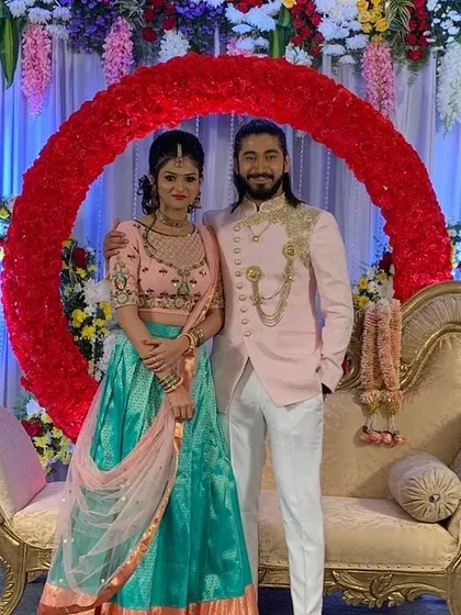 A stylish couple at their reception. Whether the style is modern or traditional, the foundation is always a match based on compatibility and shared values.