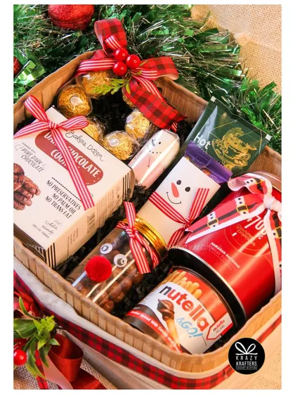 Our 'Festive Feast' Christmas hamper is a foodie's dream, packed with cookies, Nutella, hot chocolate, and more.