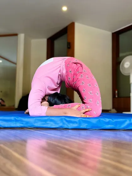 The extraordinary are here to create their own worlds. This young student holds a deep sleeping yogi pose, showcasing a level of flexibility that inspires us all.
