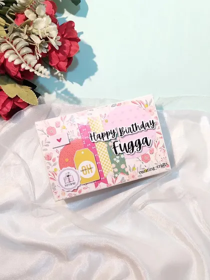 The cover of the mini scrapbook, personalized with a nickname, "Fugga".