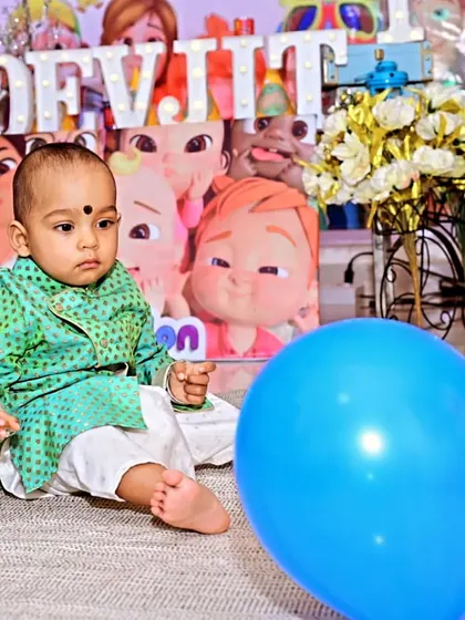 The birthday boy, Devjit, looking adorable at his Cocomelon-themed first birthday party. I also arrange for professional photographers to capture these precious, candid moments.
