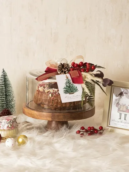 My Christmas plum cake, elegantly packaged under a glass cloche, makes for a beautiful and delicious holiday gift.