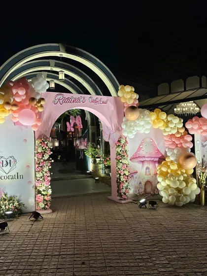 The grand entrance arch seen from a distance, glowing beautifully at night.