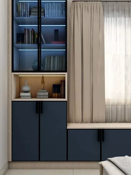 This image shows the storage unit next to the window, which includes a bookshelf with internal lighting. It’s a great way to display favorite books and treasures.