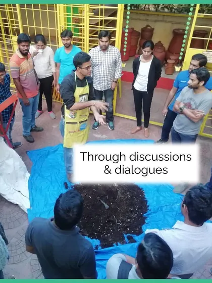 Learning through discussion and dialogue is a cornerstone of our teaching method. Here, a group gathers around a pile of compost to understand the process up close.