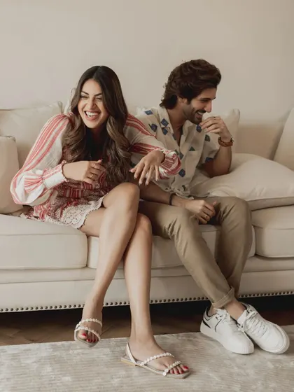 A cozy and candid moment from a pre-wedding shoot with celebrities Aditya Seal and Anushka Ranjan. This shows our ability to create a relaxed atmosphere where couples can be themselves.