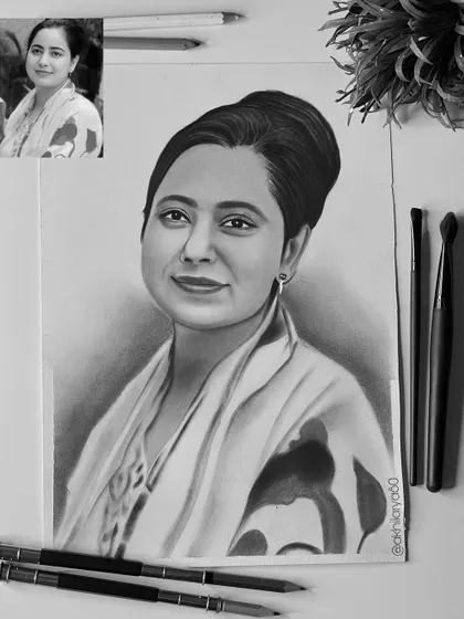 An elegant portrait of a woman with her hair in a bun, drawn on A4 paper. This graphite sketch has a classic, graceful feel.