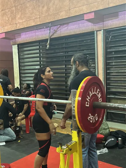 Pre-lift focus with my coach. This is the mental preparation that goes into every single attempt on the platform.