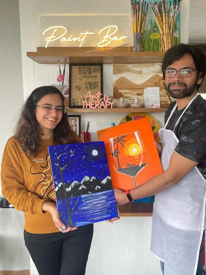 Another happy couple showing off their individual paintings from a date night workshop. It's fun to see the different interpretations of the same theme.