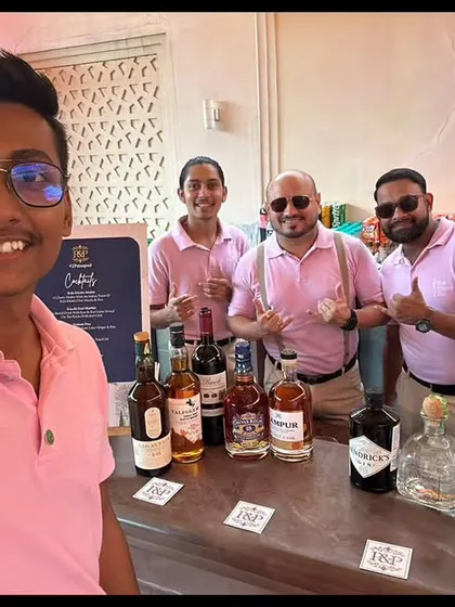 A team selfie at an outdoor event in Jaipur. Dressed in matching pink shirts, we're ready to serve drinks with a smile.