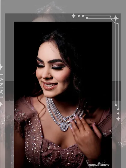A close-up portrait of the bride, Tanvi, highlighting her stunning diamond necklace and radiant makeup.