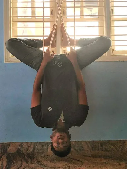 Finding inner silence while hanging in a supported inversion. Reversing the blood flow like this can feel intense at first, but it brings a unique sense of calm and clarity.