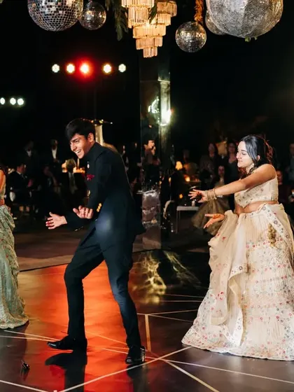 A fun moment from a group dance, with the groom's brother taking center stage.