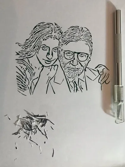 Here you can see the delicate lines of the portrait next to my craft knife. Creating this piece was a true labor of love.