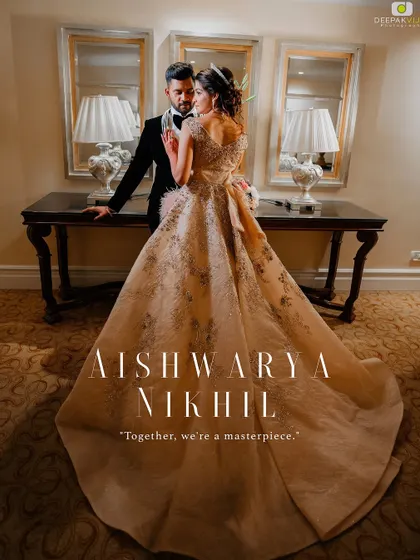 A cinematic shot of Aishwarya and Nikhil. Her makeup, featuring defined eyes and a soft lip, ensures she is the focal point, looking elegant and poised.