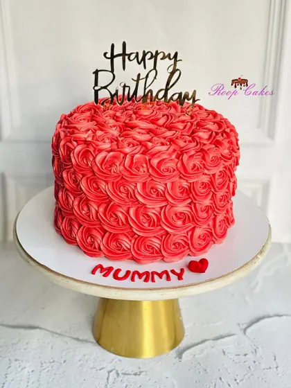 Roses, love, and cake, just for Mummy. This vibrant red cake is covered in beautifully piped rosettes, making it a perfect gift of love.