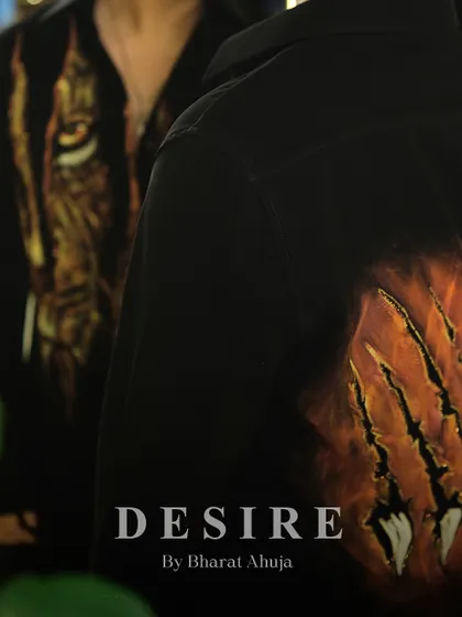 A close-up of the back of the tiger-print shirt, featuring a dramatic claw-mark design.