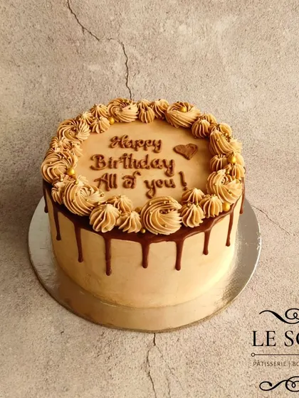 My Coffee Hazelnut cake is a classic for a reason. It features a coffee-soaked cake with milk chocolate ganache and roasted hazelnuts, finished with a mocha buttercream and chocolate drip.