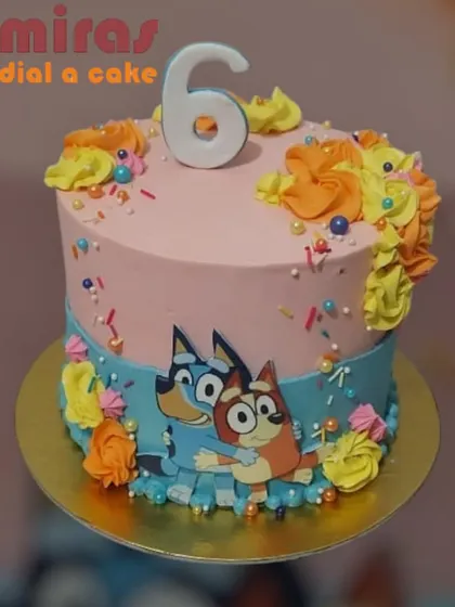 A colorful and cheerful Bluey cake for a sixth birthday. This design features Bluey and Bingo with bright floral frosting, capturing the happy and playful vibe of the show.