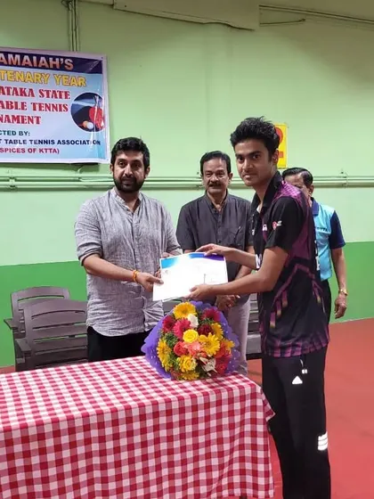 Shreyal Telang receiving his certificate after securing third place in the Men's Singles at the CVL Shastri Memorial tournament.