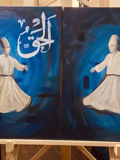 Two of the dervish paintings from the triptych, displayed on an easel in my studio. This view shows how they work together as a pair.
