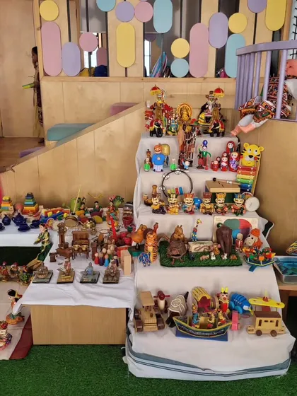 A child looks at the 'Golu' display for Dussehra, a traditional arrangement of dolls and figurines.