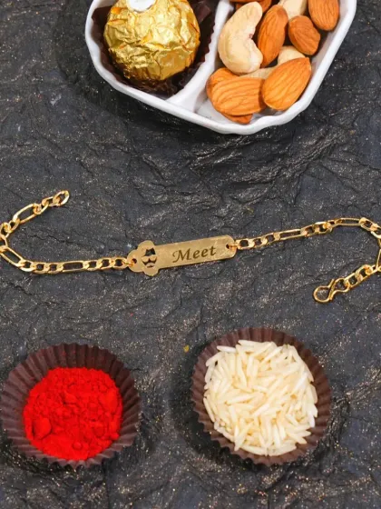 A simple yet elegant chain rakhi with a name and a small mustache charm.