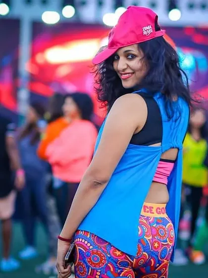 A stylish pose at a large Zumba festival. I am part of a global community and bring that world-class energy to my local events.