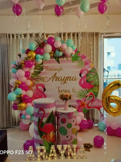 A fun and tropical flamingo theme for Arayna's 6th birthday. We used bright pinks and greens, flamingo props, and a custom backdrop to create a "flamingle" party vibe.