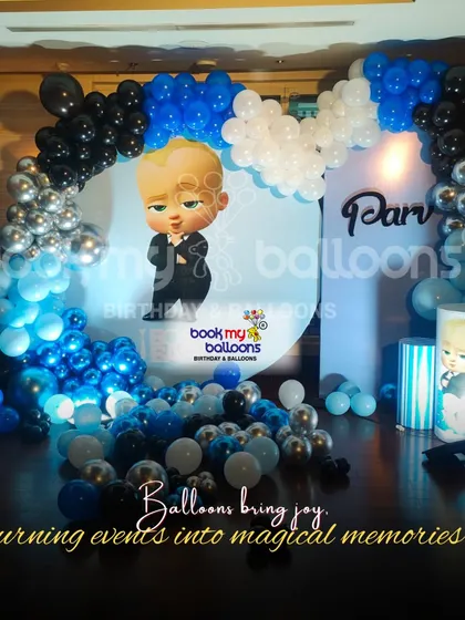 This Boss Baby theme for Parv's birthday was all business. The decor featured a cool blue, black, and silver color scheme with a large character backdrop and a stylish balloon arch, fit for the boss himself.