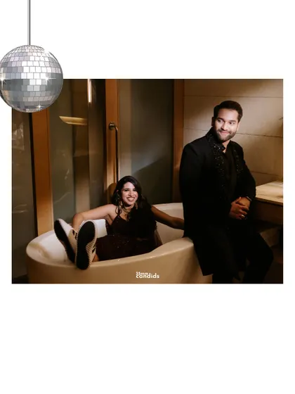 A quirky and fun shot of the couple in a bathtub, complete with a disco ball. This shows our willingness to get creative and capture the couple's unique personality.