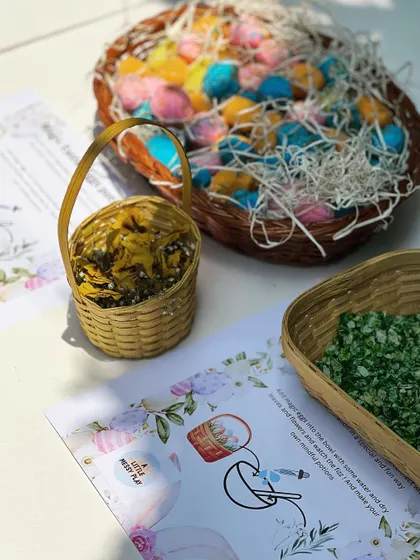 Our Easter-themed activity setup, ready for some messy fun. This kit included colorful magic eggs, natural fillers, and a simple instruction card for a fizzing potion activity.
